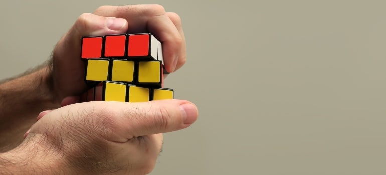 person solving a rubik cube